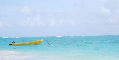 Punta Cana sea with yellow boat.
